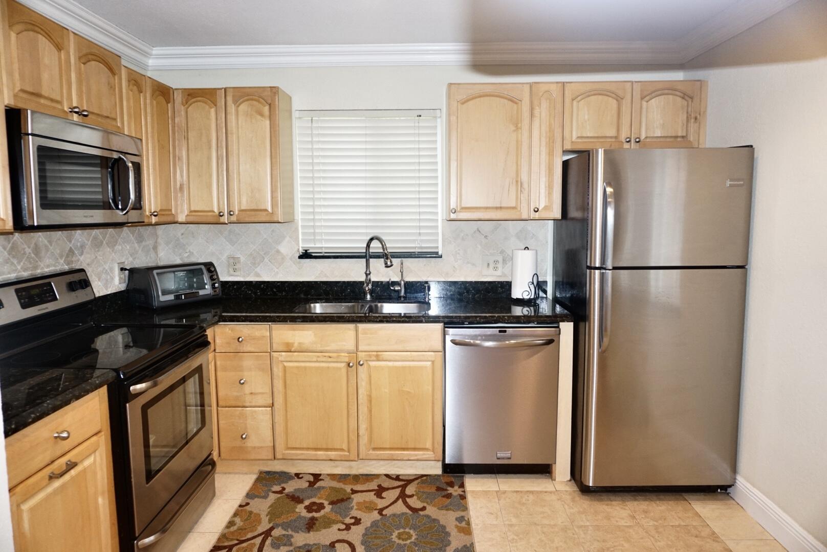 6259 Garrett Street Jupiter, FL 33458 - Photo 9 of 19 85932E11-BECD-46C6-91F9-1FF93EFBA919