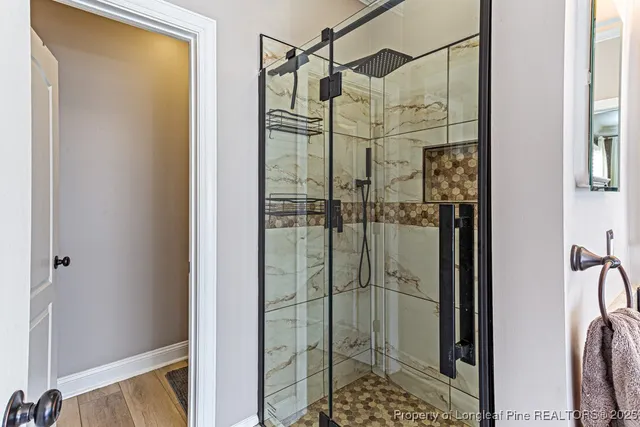 a bathroom with a shower and a sink