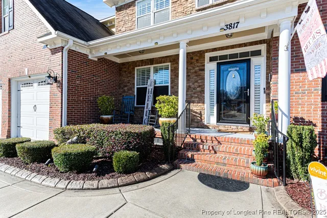 a front view of a house with outdoor seating