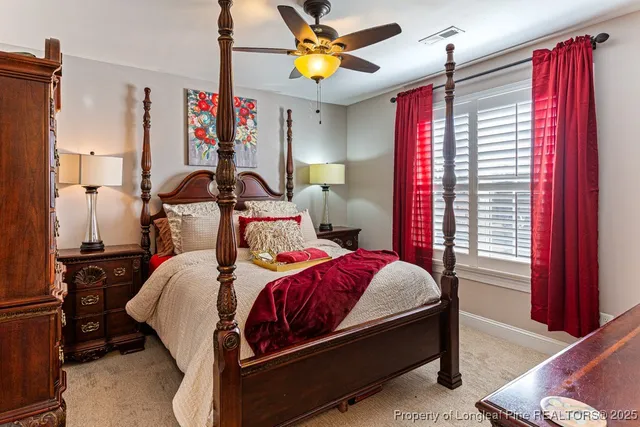 a bedroom with bed and window