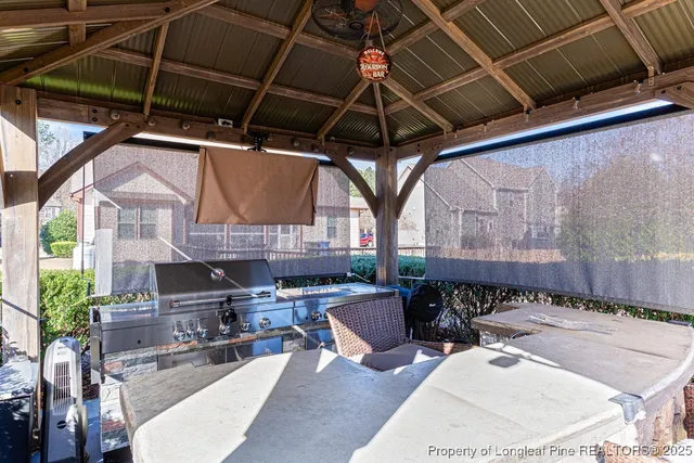a building outdoor space with patio furniture and potted plants