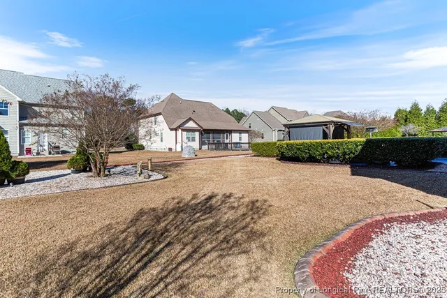 a view of multiple houses with a street