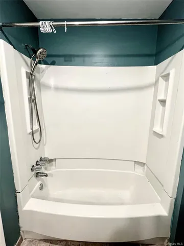 a bathroom with a toilet mirror and vanity