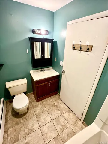 an empty room with a empty space and a window