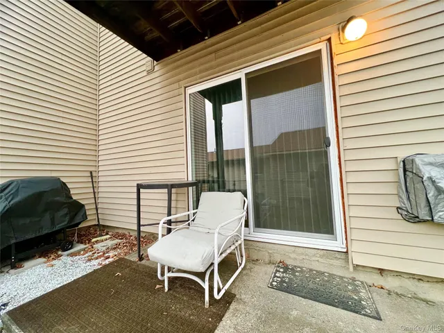 a view of a swimming pool with an outdoor seating and a yard