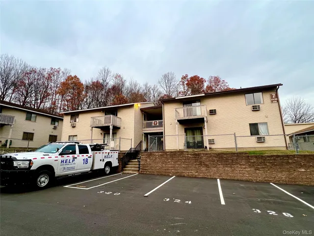 a view of a car park in front of house