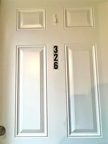 a front view of a house with a garage