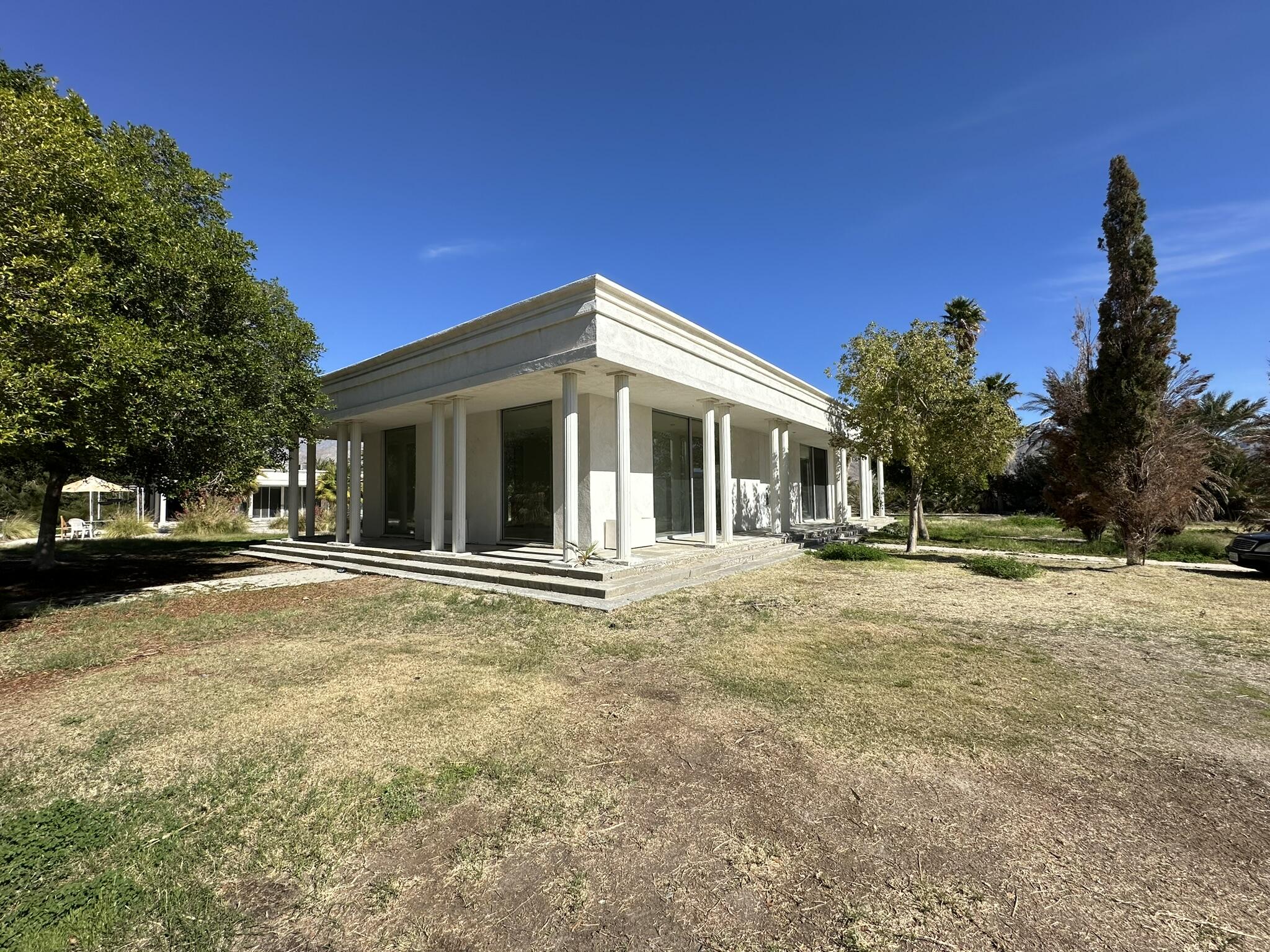 39200 Dillon Road Indio, CA 92203 - Photo 19 of 22 a view of a house with backyard and a tree