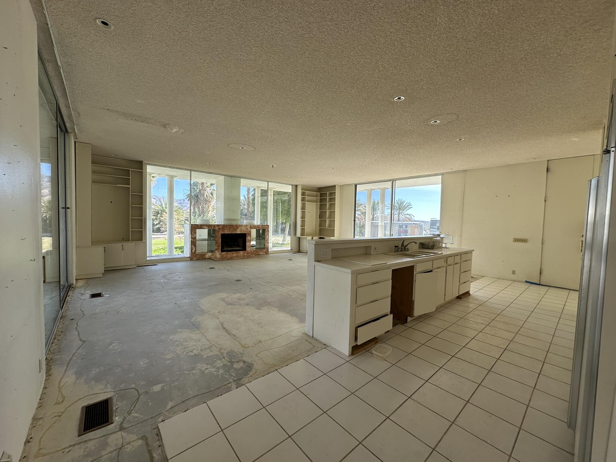 39200 Dillon Road Indio, CA 92203 - Photo 5 of 22 a large white kitchen with a sink and cabinets