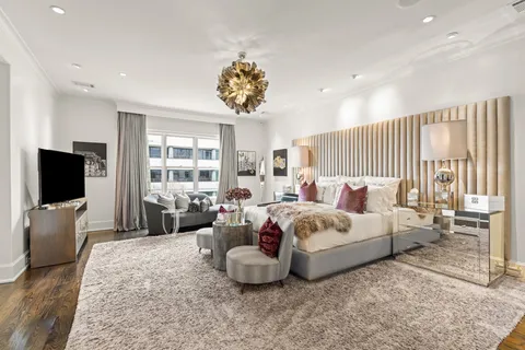 a view of balcony with furniture and city view