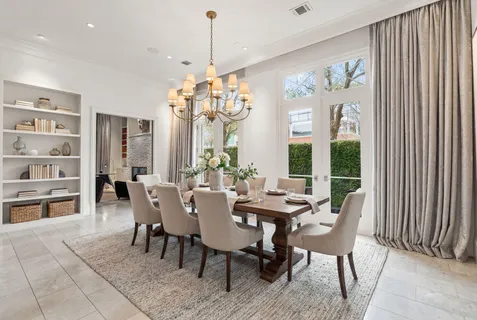 a living room with furniture wooden floor and a chandelier