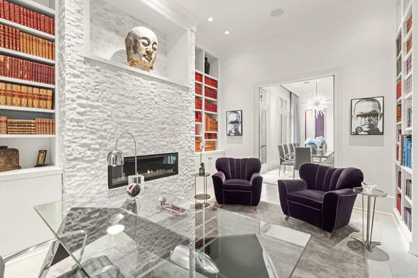 a living room with furniture or couch and a fireplace