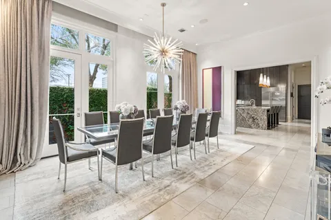 a kitchen with granite countertop a sink a counter top space and stainless steel appliances