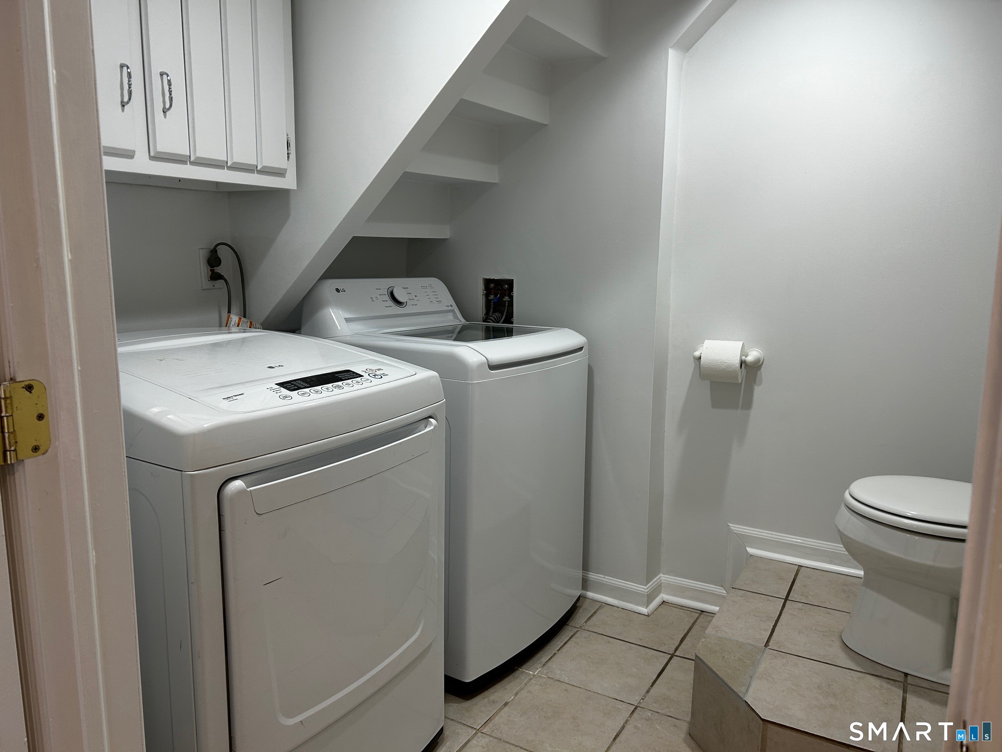 97 Godfrey Road Fairfield, CT 06825 - Photo 25 of 33 laundry room with half bath in the basement.