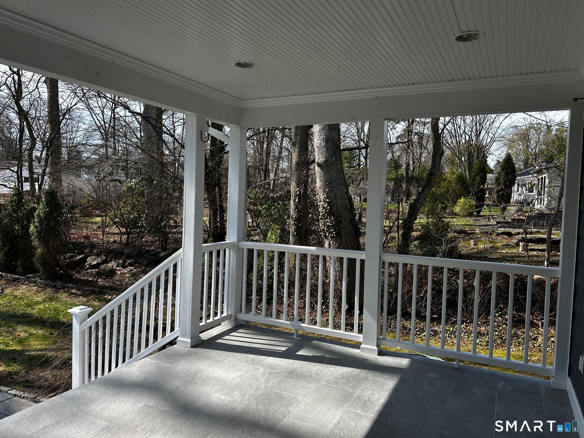 97 Godfrey Road Fairfield, CT 06825 - Photo 8 of 33 Covered deck in the back of the house.