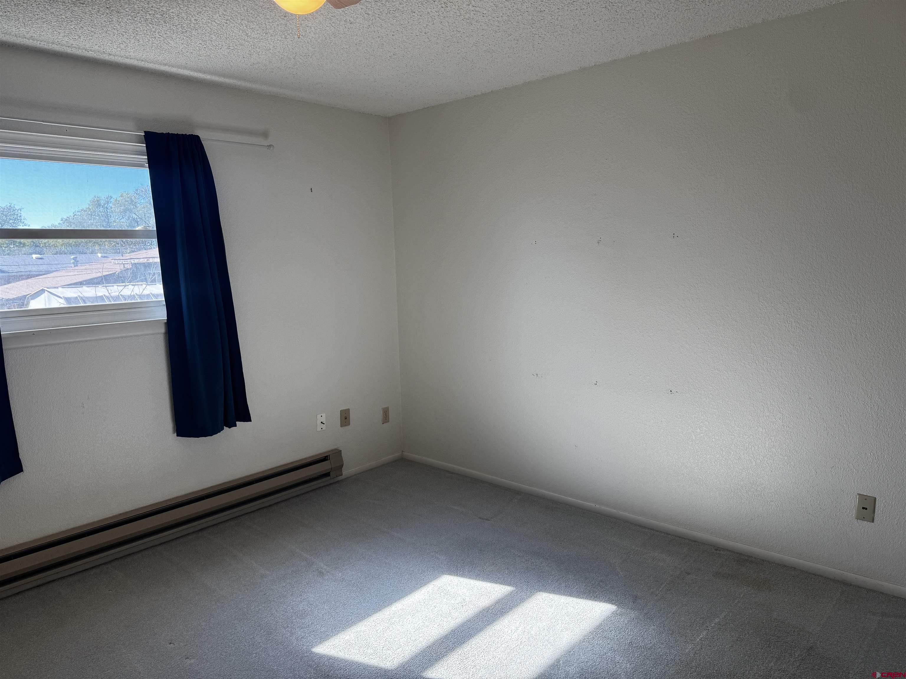 345 1/2 Northwest 4th Street Cedaredge, CO 81413 - Photo 14 of 28 an empty room with window