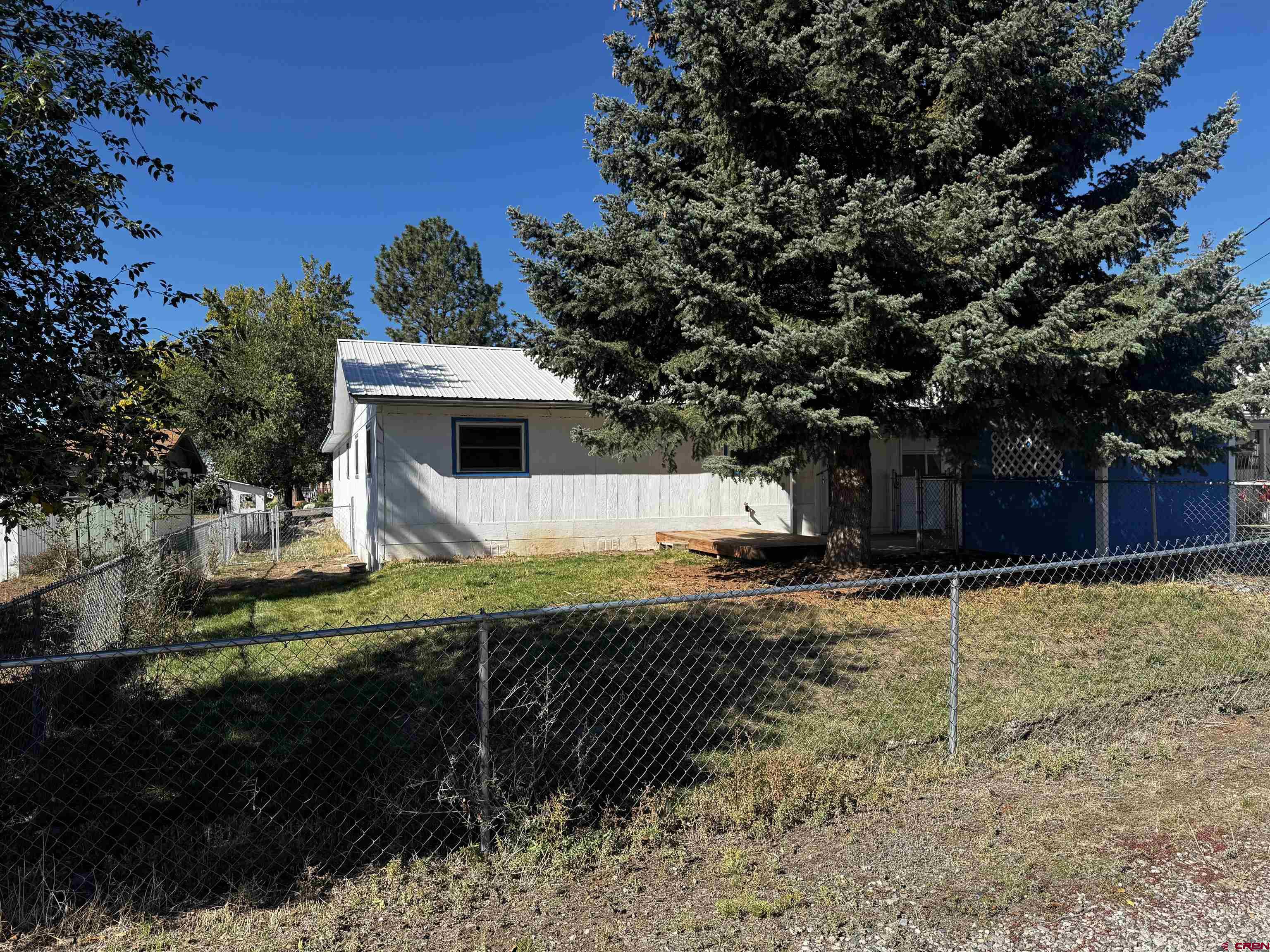 345 1/2 Northwest 4th Street Cedaredge, CO 81413 - Photo 4 of 28 a view of a house with a yard