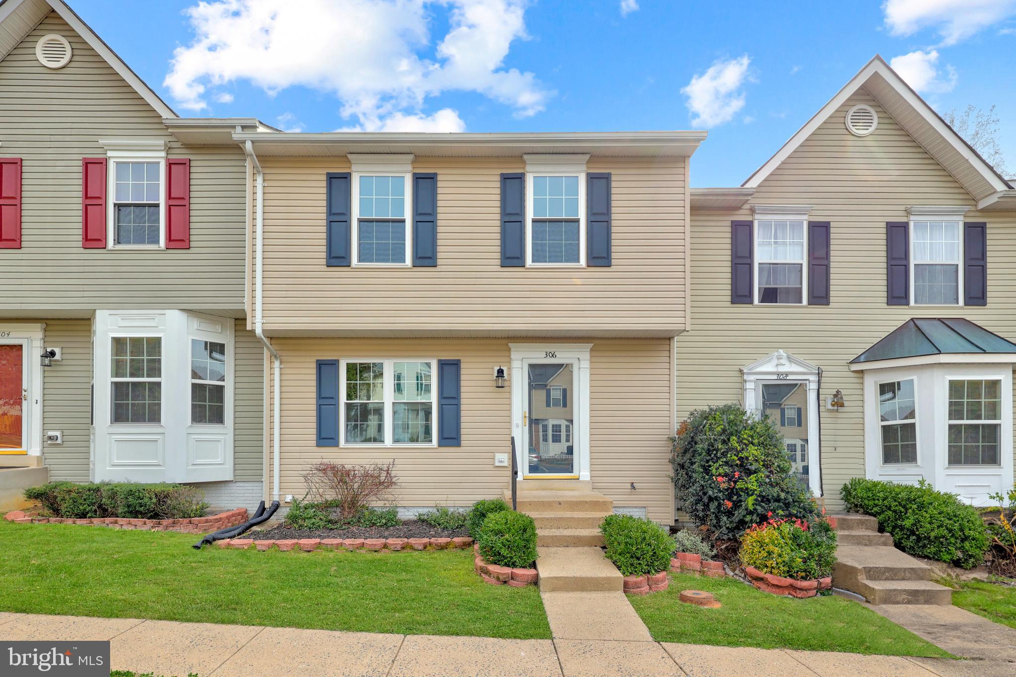 306 Kings Crest Drive Stafford, VA 22554 - Photo 1 of 41 a front view of a house with a yard and potted plants