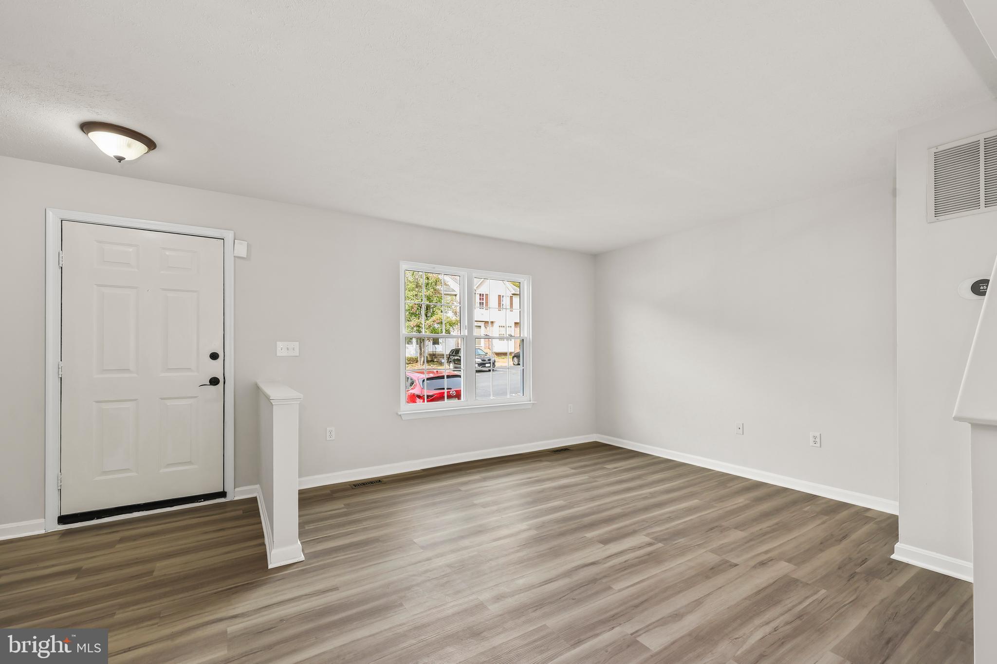 306 Kings Crest Drive Stafford, VA 22554 - Photo 15 of 41 an empty room with wooden floor and window