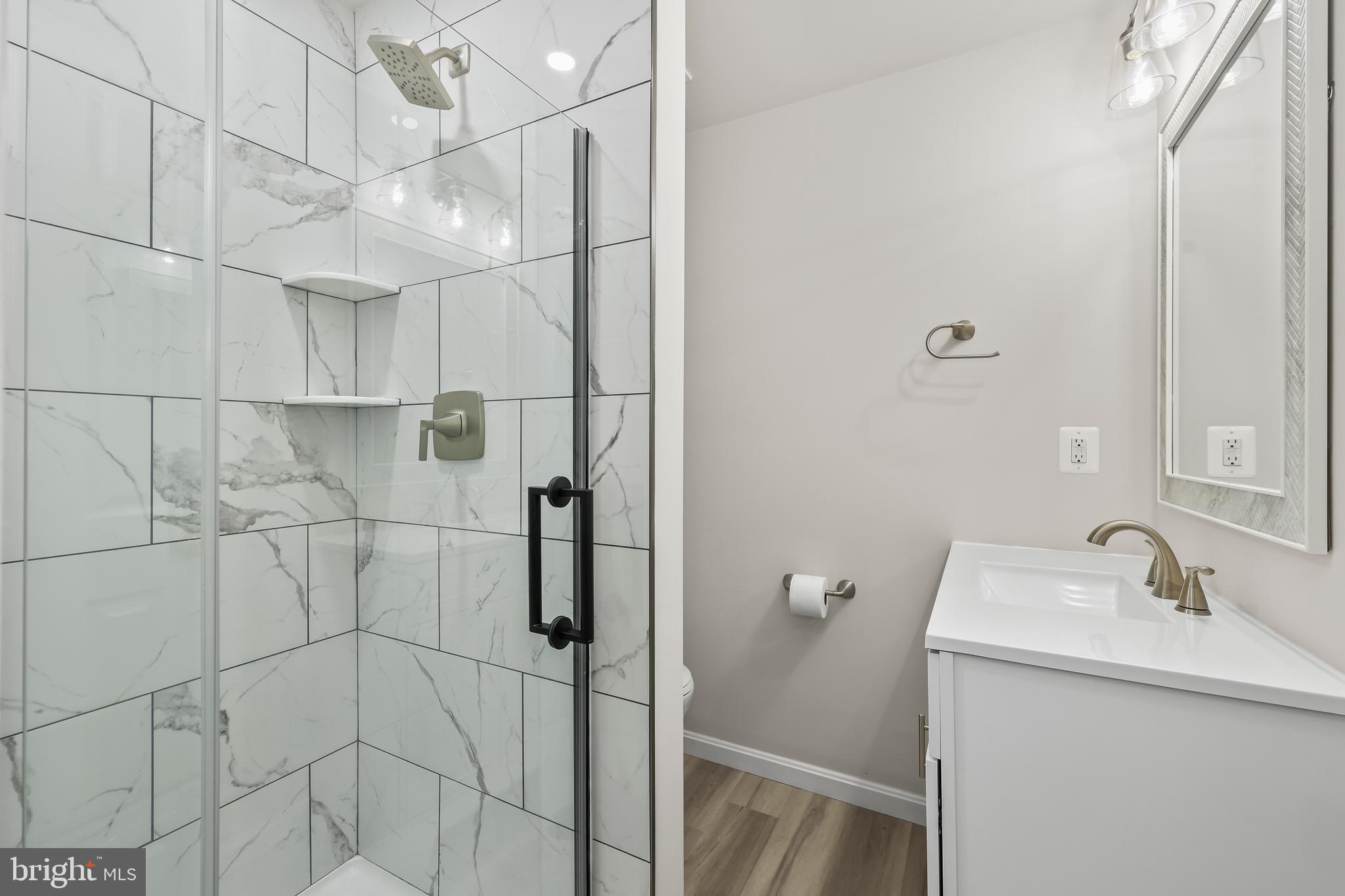 306 Kings Crest Drive Stafford, VA 22554 - Photo 22 of 41 a bathroom with a sink a toilet and shower