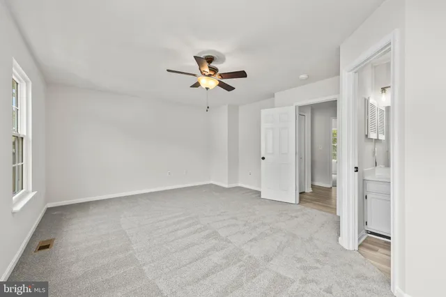 a view of a bathroom from a hallway