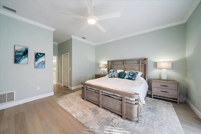 a bedroom with a bed window and a desk