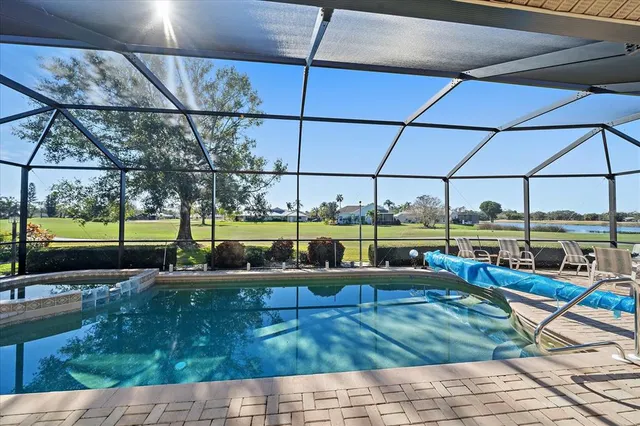 a view of a porch with furniture and floor to ceiling window