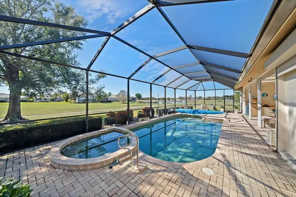 a view of a patio with dining table and chairs