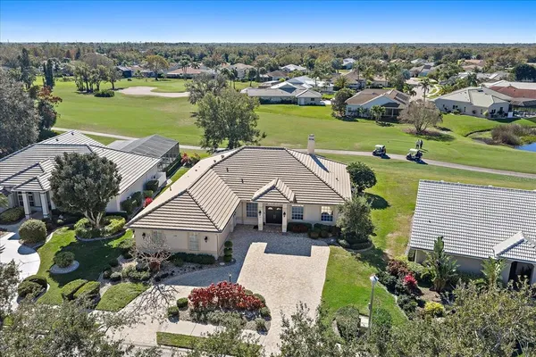 an aerial view of a house with a garden