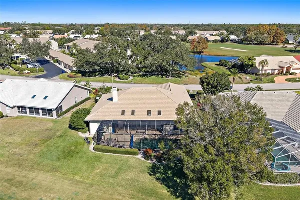 an aerial view of a houses and an outdoor space