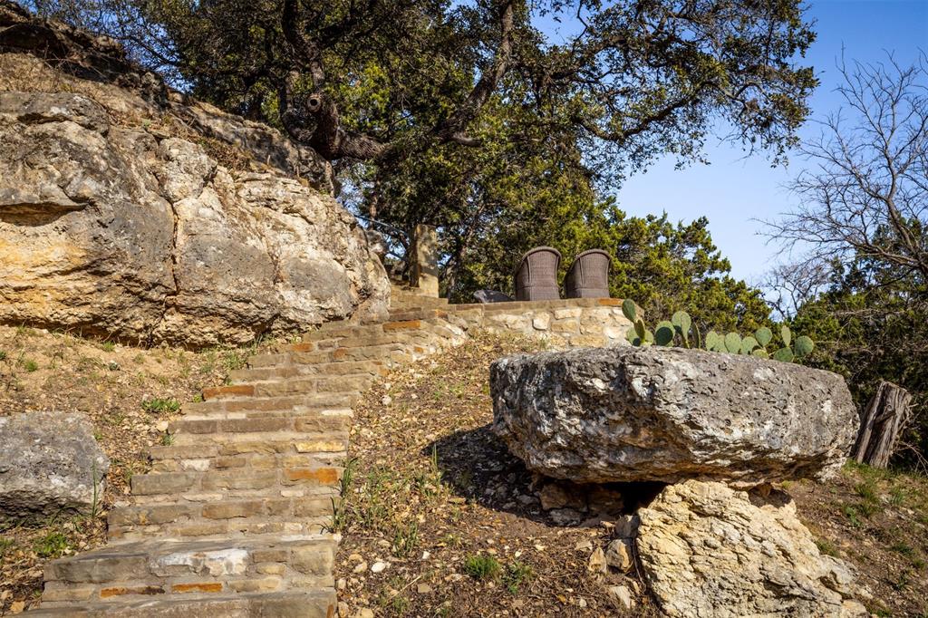 5255 Lookout Ridge Drive Marble Falls, TX 78654 - Photo 10 of 40 Stone steps and patio terrace beside canyon rim