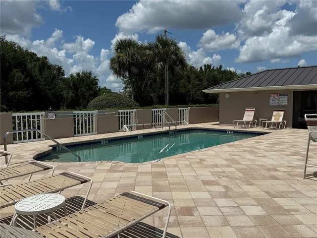 a view of a house with backyard and porch