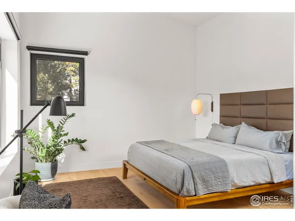 a bathroom with a double vanity sink a mirror and a shower