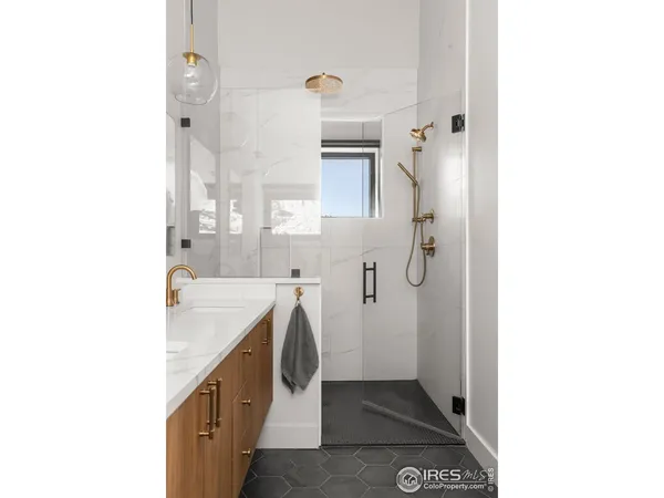 a white bath tub sitting next to a white sink