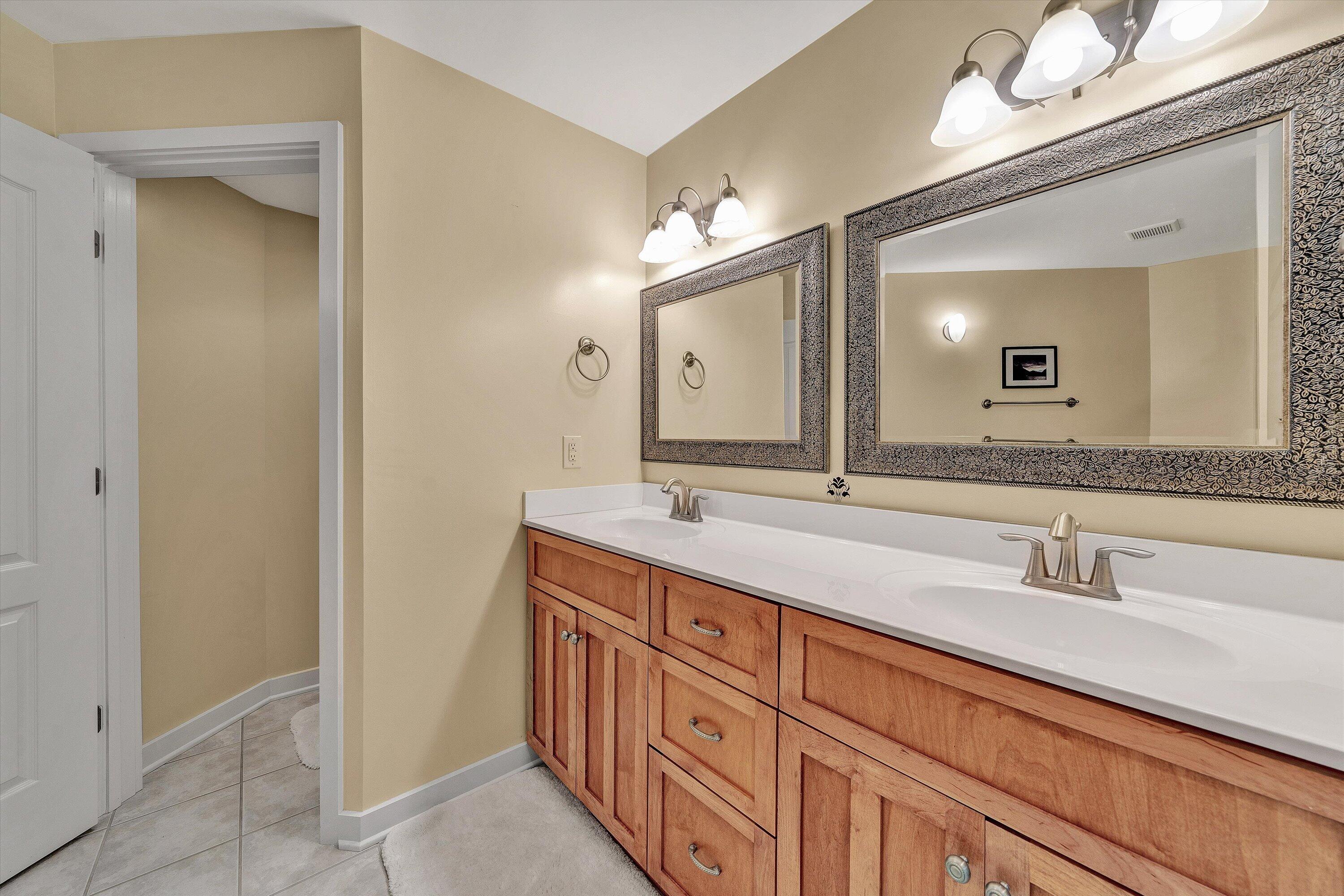 207 Winding Way Union Hall, VA 24176 - Photo 38 of 60 a bathroom with double sink and a mirror