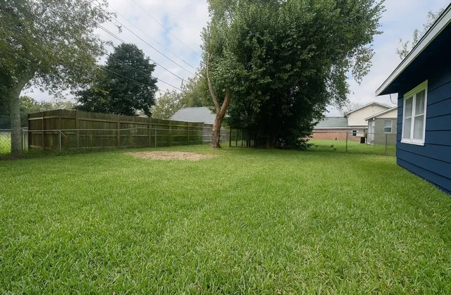 a backyard of a house with lots of green space