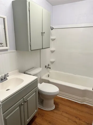 a bathroom with a sink a toilet and bathtub