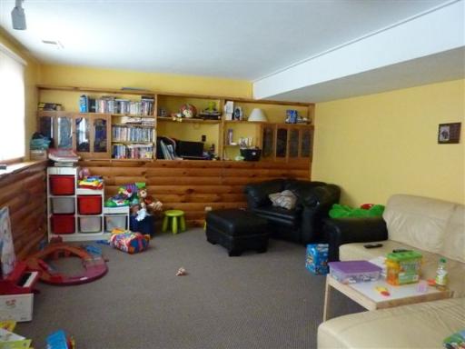 607 Surryse Road Lake Zurich, IL 60047 - Photo 14 of 15 a room with furniture toys and a flat screen tv