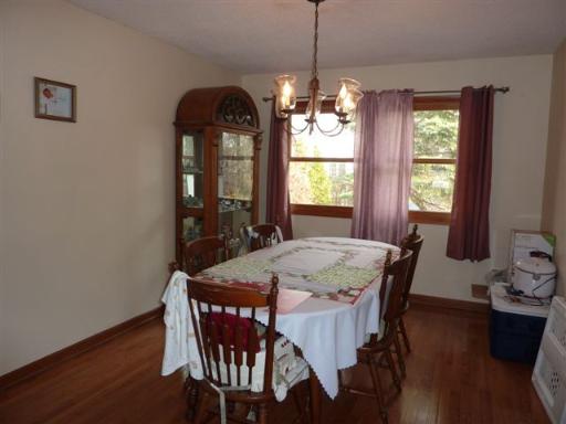 607 Surryse Road Lake Zurich, IL 60047 - Photo 3 of 15 a view of a dining room with furniture window and wooden floor