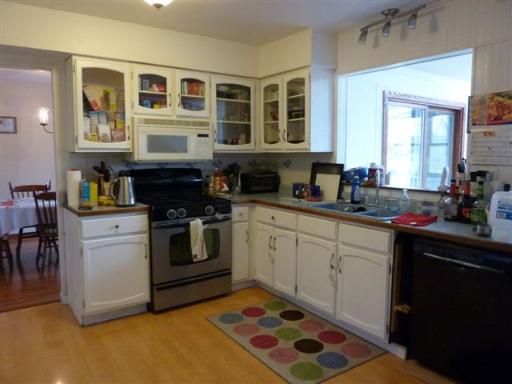 607 Surryse Road Lake Zurich, IL 60047 - Photo 5 of 15 a kitchen with a stove window and cabinets