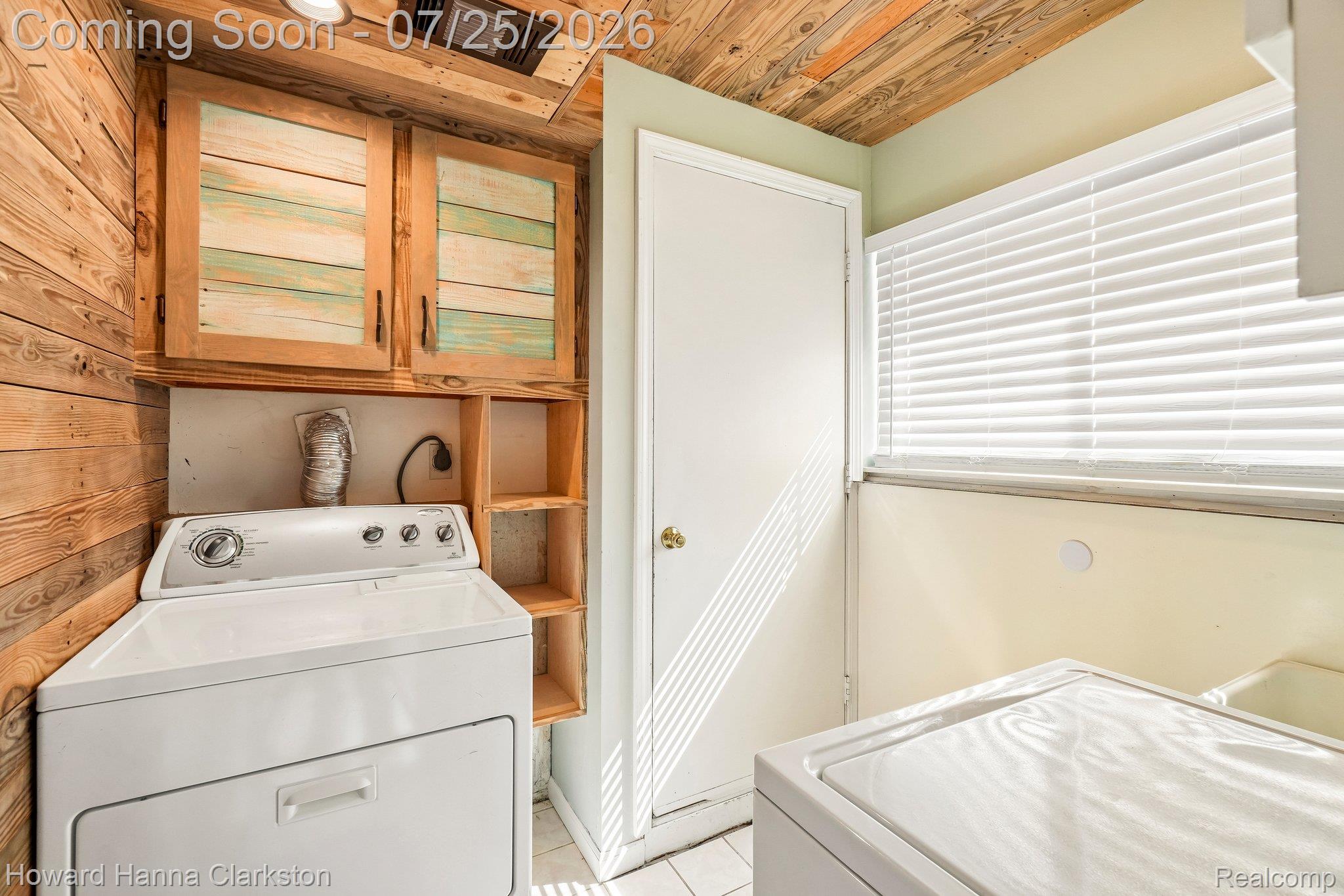950 Beardon Road Lake Orion, MI 48362 - Photo 27 of 40 Lower level laundry with storage. Door leads to garage.
