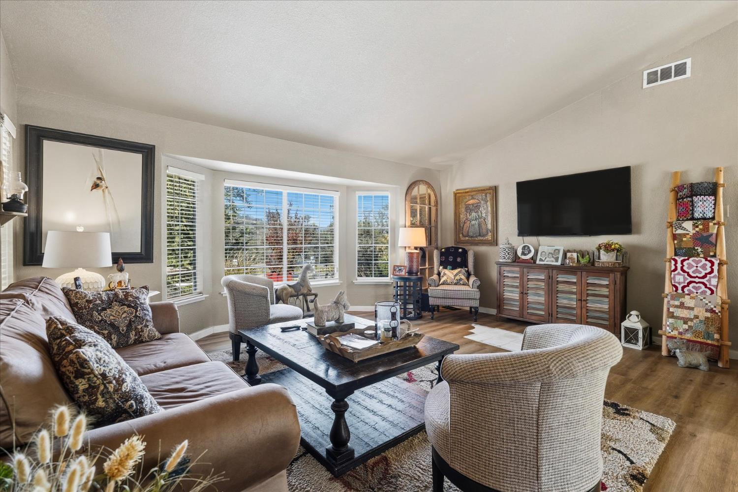 32583 River Knolls Road Coarsegold, CA 93614 - Photo 14 of 63 a living room with furniture and a flat screen tv