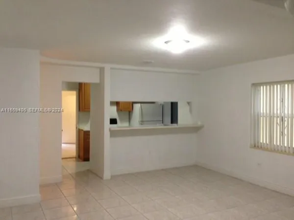 a view of empty room with windows