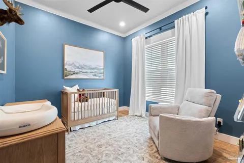 a bathroom with a toilet a sink and a window