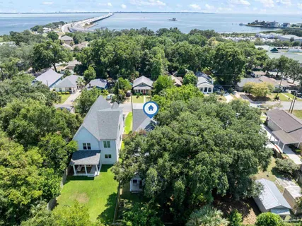 an aerial view of a house with yard swimming pool and outdoor seating