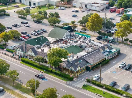 an aerial view of a house with a garden