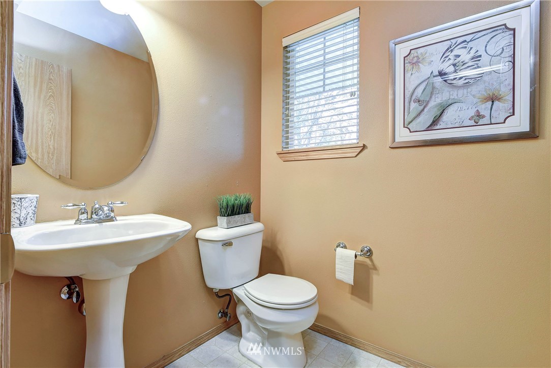 2324 194th Street Southeast Bothell, WA 98012 - Photo 13 of 22 a bathroom with a toilet a sink and mirror