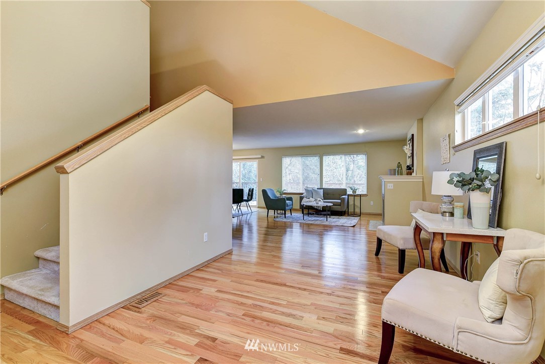 2324 194th Street Southeast Bothell, WA 98012 - Photo 15 of 22 a view of livingroom with dining room and wooden floor