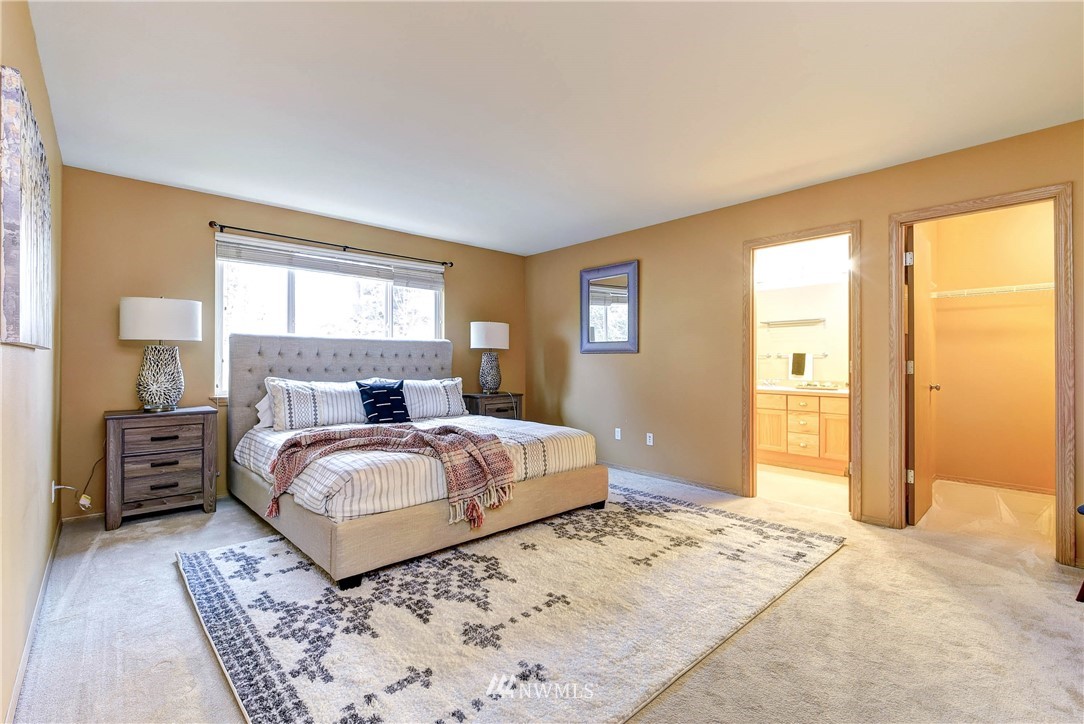 2324 194th Street Southeast Bothell, WA 98012 - Photo 18 of 22 a bedroom with a large bed and a window