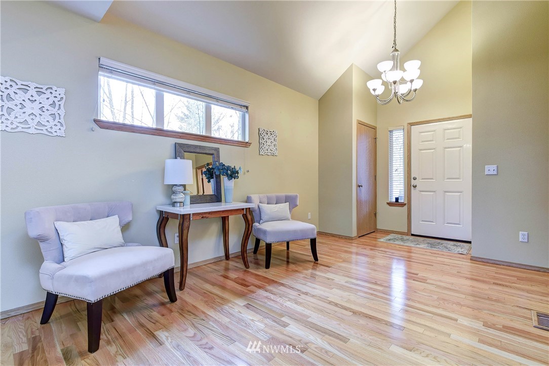 2324 194th Street Southeast Bothell, WA 98012 - Photo 4 of 22 a view of a livingroom with furniture window and wooden floor